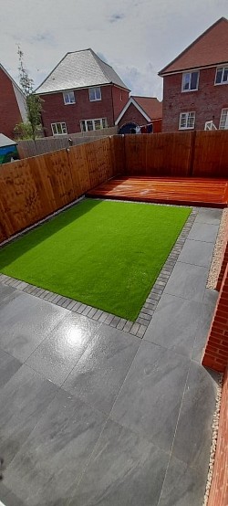 Porcelain patio with artificial grass and hardwood decking