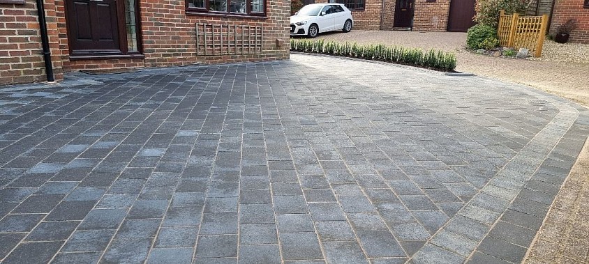 Job complete for a very happy customer. We used Tobermore Shannon duo block paving in charcoal. Laying the blocks on a 45 degree angle not ony makes the space seem larger, it also gives it more strentgh.