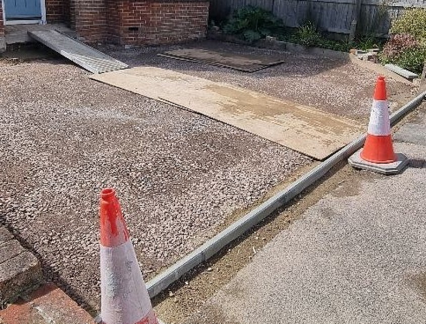 A full excavation and a proper sub-base was installed and a new concrete kerb entrance